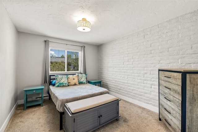 13 Cedar Ct Unit 13, Steamboat Springs, CO 80487 - bedroom featuring light colored carpet, a baseboard radiator, and a textured ceiling