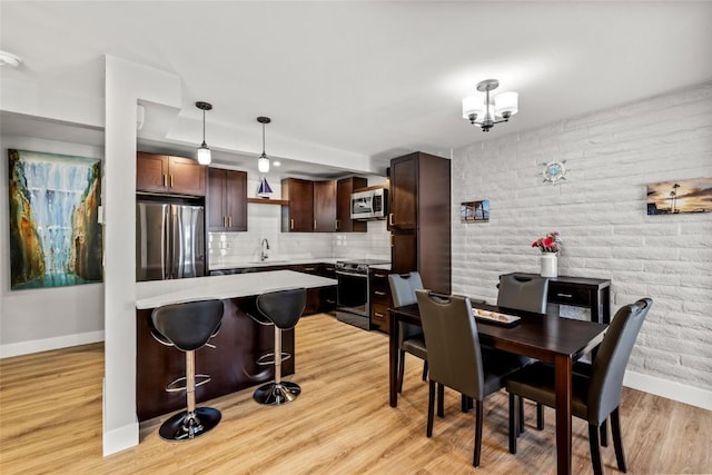 13 Cedar Ct Unit 13, Steamboat Springs, CO 80487 - dining space featuring baseboards and light wood finished floors