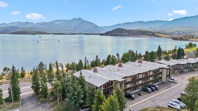 aerial view featuring a water and mountain view