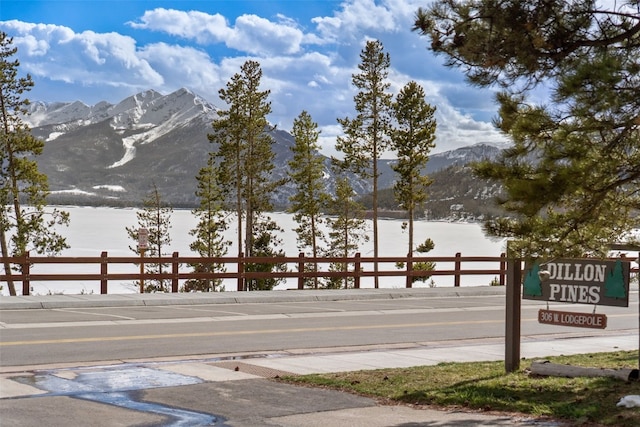 view of road featuring sidewalks and a mountain view