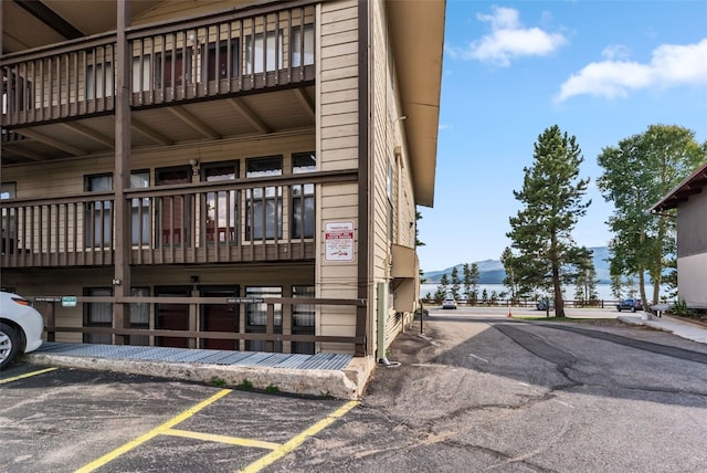 exterior space featuring uncovered parking and a mountain view