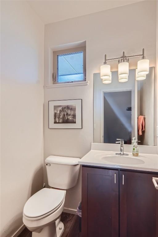 835 Weiss Cir Unit 2, Steamboat Springs, CO 80487 - bathroom featuring toilet, vanity, and baseboards