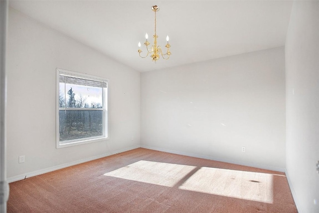 spare room featuring carpet floors, baseboards, a chandelier, and lofted ceiling