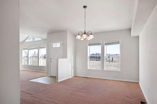 unfurnished dining area featuring baseboards, carpet, and a notable chandelier