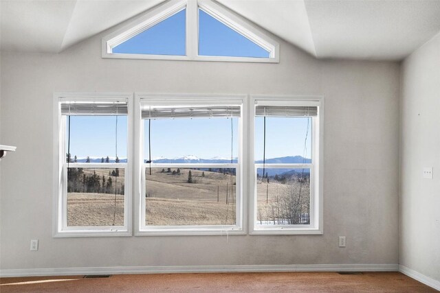 306 Shoshone Dr, Como, CO 80456 - empty room with baseboards, plenty of natural light, a mountain view, and visible vents