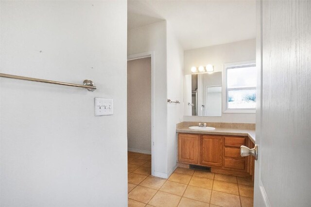 306 Shoshone Dr, Como, CO 80456 - bathroom with vanity, tile patterned flooring, baseboards, and visible vents