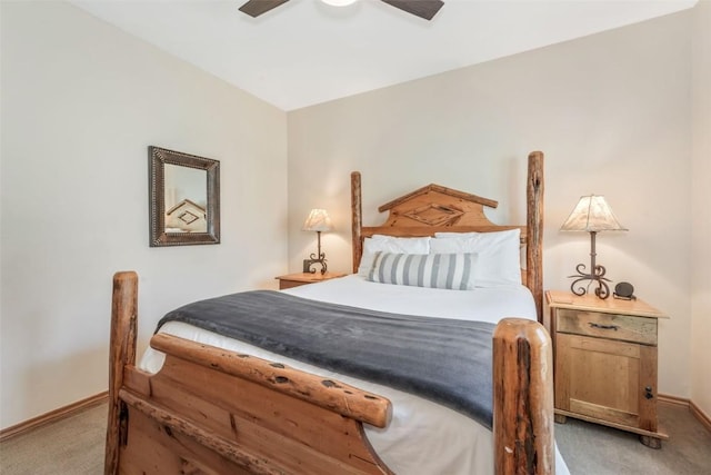 bedroom featuring baseboards, light carpet, and ceiling fan