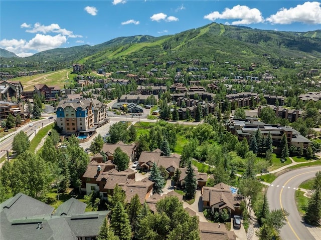birds eye view of property with a mountain view and a residential view