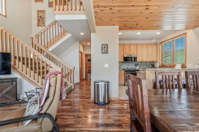 dining area with stairway, recessed lighting, and wood finished floors