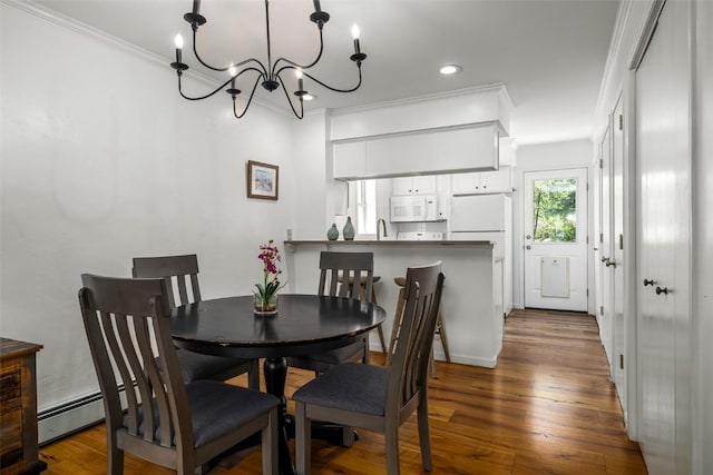 3100 Chinook Ln Unit 6, Steamboat Springs, CO 80487 - dining space featuring a chandelier, ornamental molding, hardwood / wood-style flooring, and recessed lighting