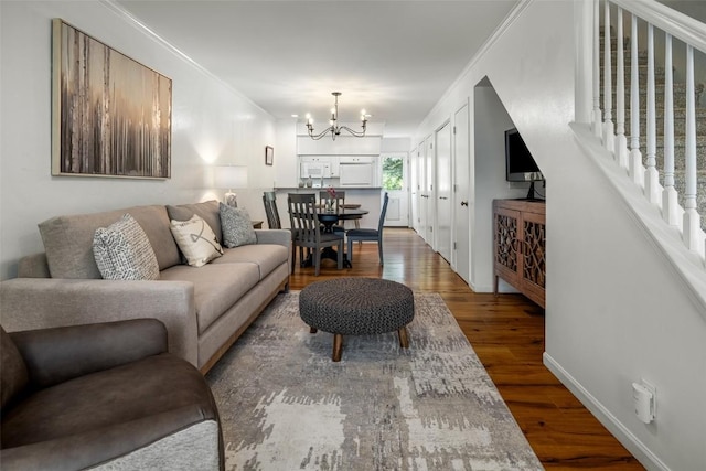 3100 Chinook Ln Unit 6, Steamboat Springs, CO 80487 - living area featuring a chandelier, wood finished floors, stairs, and crown molding