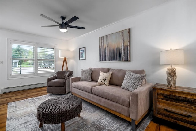 3100 Chinook Ln Unit 6, Steamboat Springs, CO 80487 - living room with baseboard heating, wood finished floors, ceiling fan, and ornamental molding