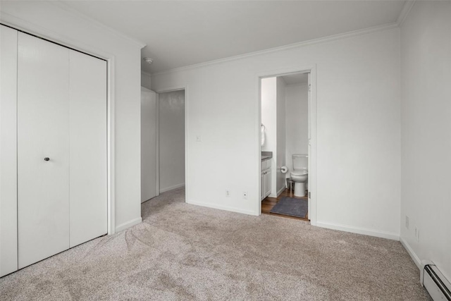 3100 Chinook Ln Unit 6, Steamboat Springs, CO 80487 - unfurnished bedroom featuring a baseboard heating unit, carpet flooring, crown molding, a closet, and baseboards