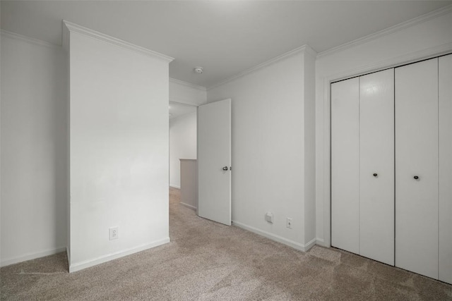 3100 Chinook Ln Unit 6, Steamboat Springs, CO 80487 - unfurnished bedroom featuring carpet flooring, a closet, crown molding, and baseboards