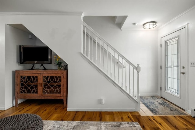 3100 Chinook Ln Unit 6, Steamboat Springs, CO 80487 - foyer featuring wood finished floors, stairway, baseboards, and crown molding