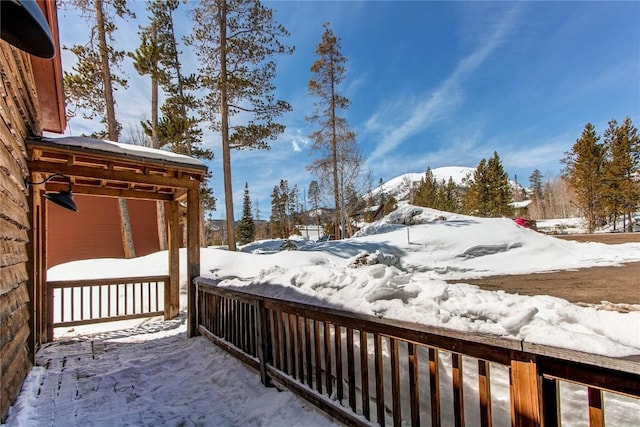 view of snow covered deck