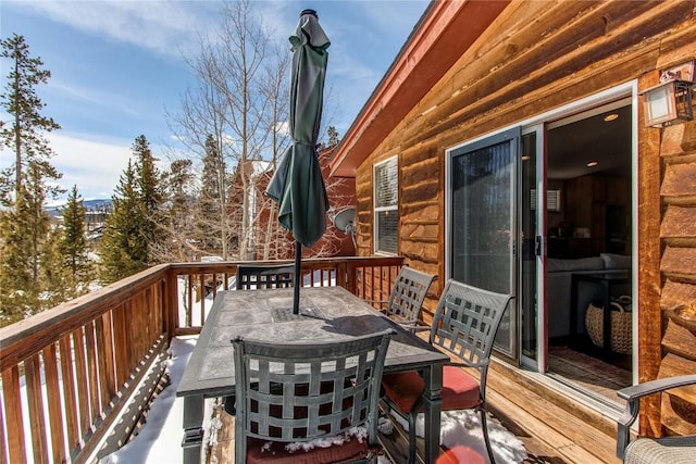 deck with outdoor dining space