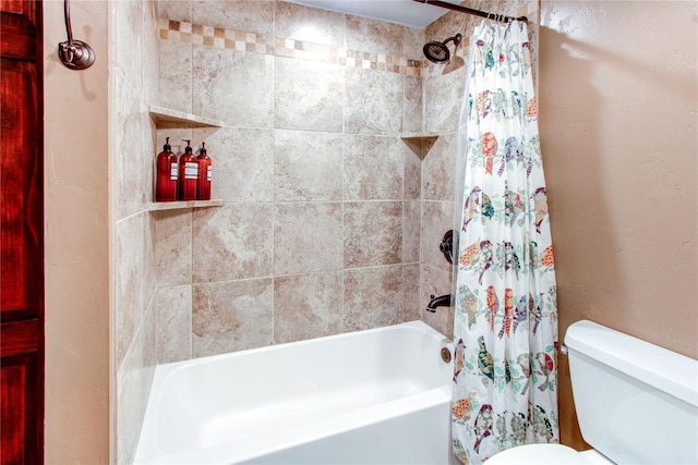bathroom with shower / bath combination with curtain and toilet