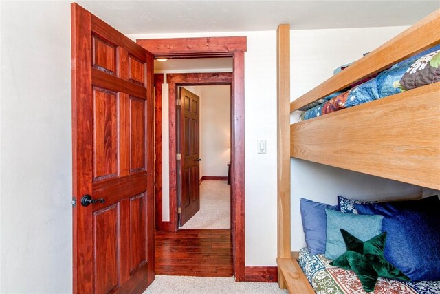 hallway featuring baseboards
