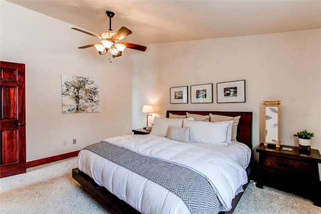 bedroom with ceiling fan, carpet floors, vaulted ceiling, and baseboards
