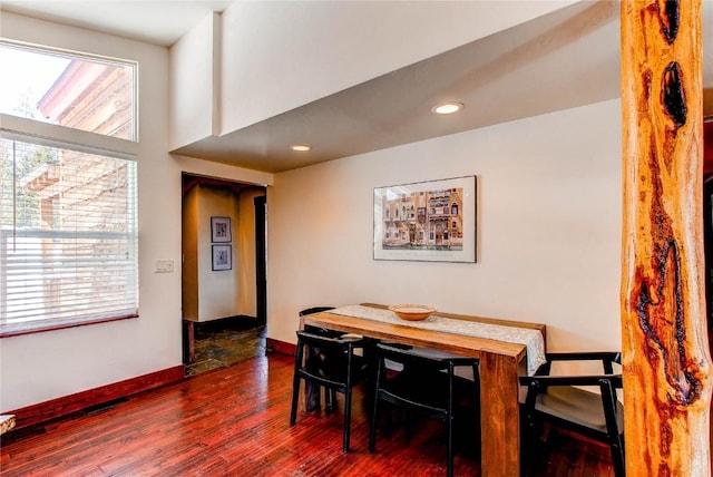 dining space featuring baseboards, wood finished floors, recessed lighting, and a healthy amount of sunlight