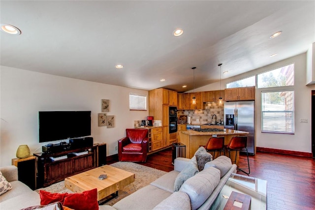living room with lofted ceiling, baseboards, recessed lighting, and dark wood finished floors
