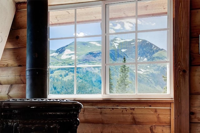 details featuring a mountain view and a wood stove