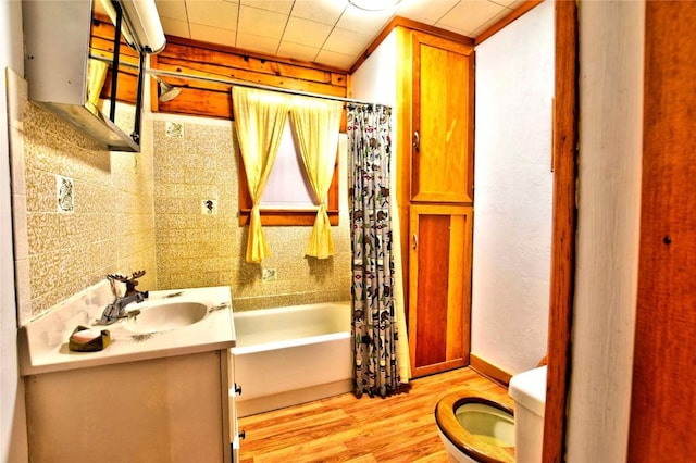 446 Chief Trl, Como, CO 80432 - bathroom with toilet, wood finished floors, vanity, and shower / bath combo with shower curtain