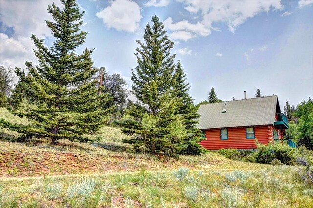 446 Chief Trl, Como, CO 80432 - view of side of home featuring log exterior and metal roof