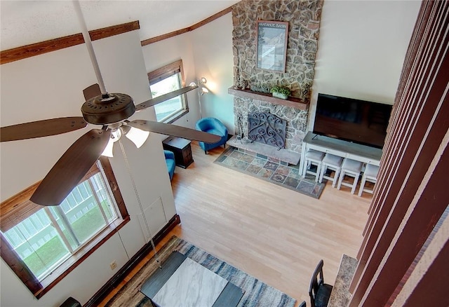 350 Old Fish Creek Falls Rd Unit 350, Steamboat Springs, CO 80487 - living area with ceiling fan, wood finished floors, and a stone fireplace