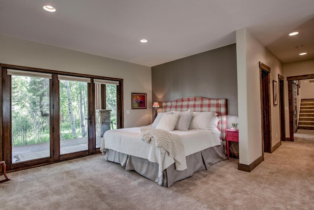bedroom with baseboards, access to outside, light carpet, and recessed lighting