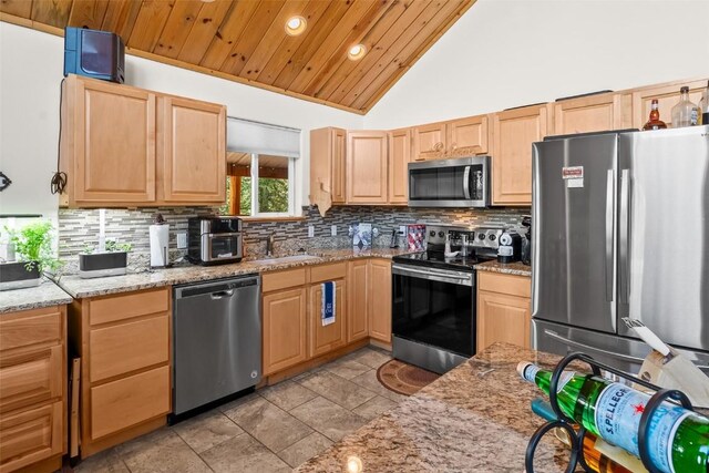 36 Gitche Goone Ln, Como, CO 80432 - kitchen with appliances with stainless steel finishes, light brown cabinetry, recessed lighting, backsplash, and a sink