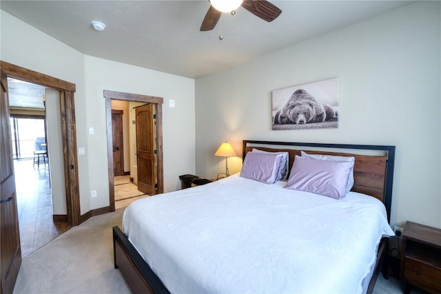421 Rainbow Dr Unit 12, Silverthorne, CO 80498 - bedroom featuring light carpet, ceiling fan, ensuite bathroom, and baseboards