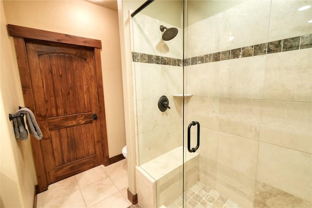 421 Rainbow Dr Unit 12, Silverthorne, CO 80498 - bathroom with a stall shower, toilet, and tile patterned flooring