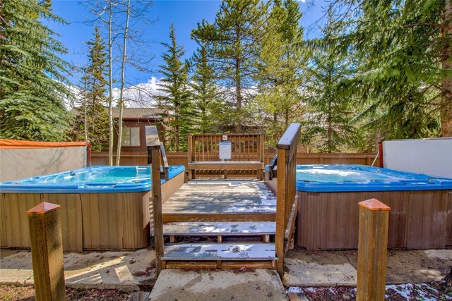 110 Sawmill Rd Unit 6B, Breckenridge, CO 80424 - deck featuring a hot tub and fence