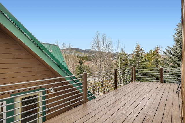 wooden terrace with a mountain view