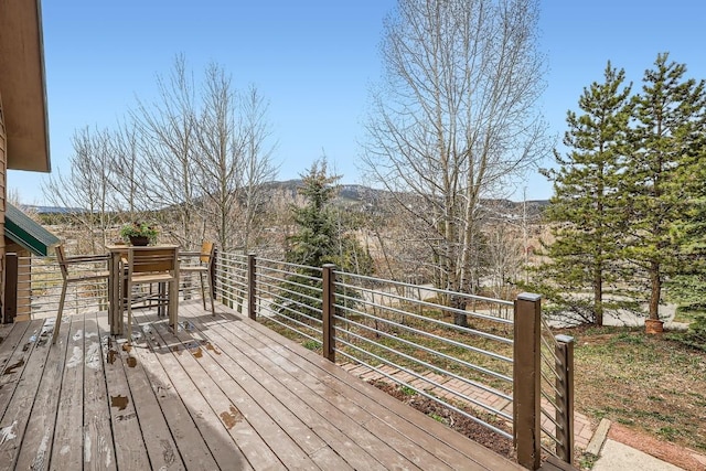 wooden terrace featuring a mountain view