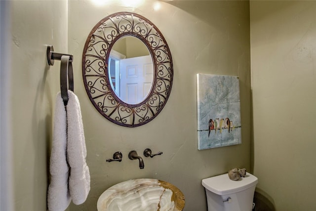 bathroom featuring toilet