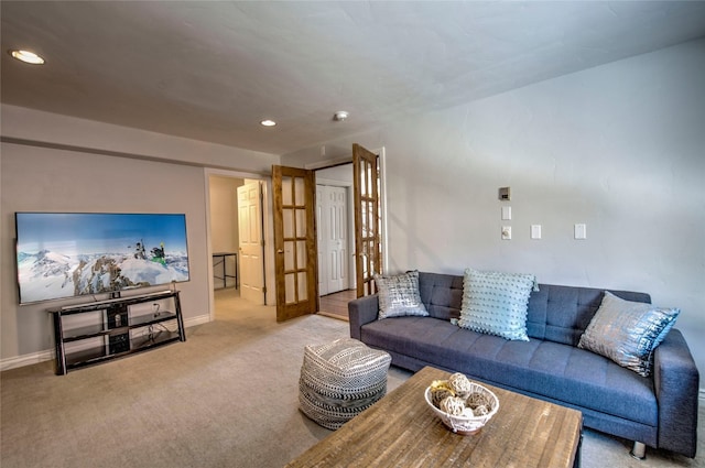 living area with carpet, baseboards, and recessed lighting