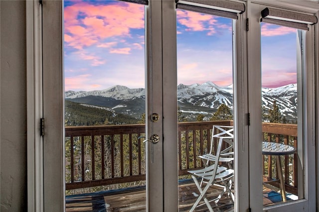 doorway to outside with a mountain view