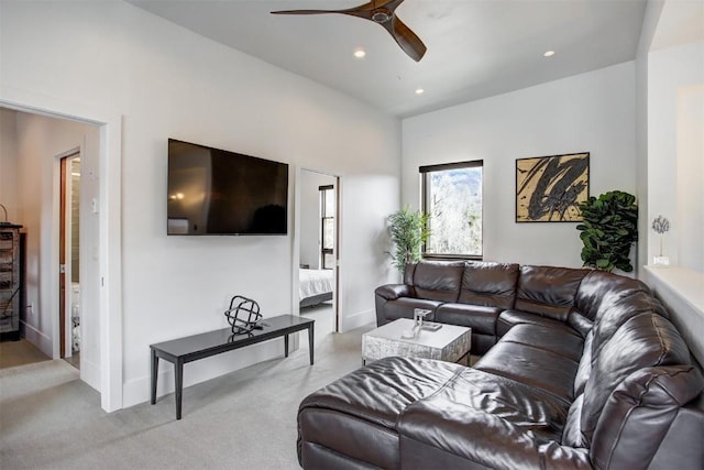 carpeted living room with recessed lighting, a ceiling fan, and baseboards