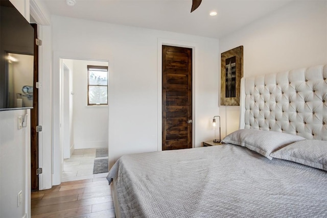 bedroom featuring recessed lighting and hardwood / wood-style floors