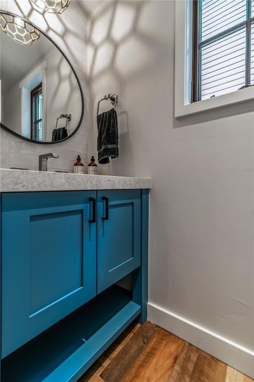208 N Ridge St, Breckenridge, CO 80424 - bathroom featuring baseboards, wood finished floors, and vanity