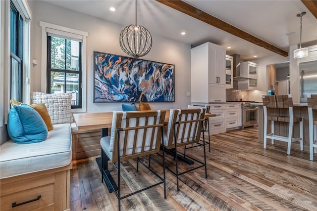 208 N Ridge St, Breckenridge, CO 80424 - dining space featuring recessed lighting, wood finished floors, beam ceiling, and a notable chandelier