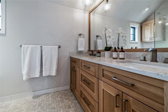 208 N Ridge St, Breckenridge, CO 80424 - full bath featuring tile patterned floors, a sink, double vanity, a shower with door, and lofted ceiling