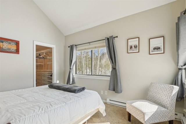 carpeted bedroom featuring a baseboard heating unit and vaulted ceiling