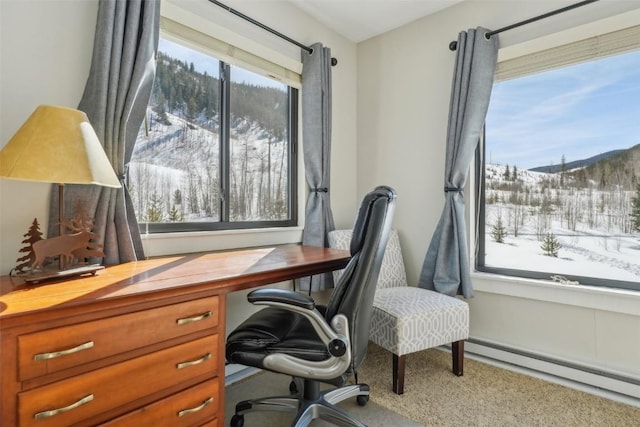 office with a wealth of natural light, a mountain view, and a baseboard radiator