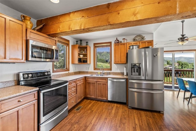 524 Buena Vista Ct, Steamboat Springs, CO 80487 - kitchen with appliances with stainless steel finishes, dark wood-style floors, healthy amount of natural light, and light countertops