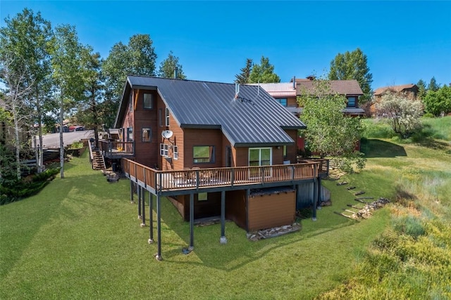 524 Buena Vista Ct, Steamboat Springs, CO 80487 - rear view of house with a wooden deck, stairway, and a lawn