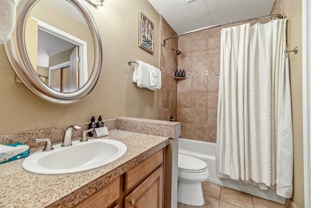 bathroom featuring tile patterned flooring, shower / tub combo with curtain, toilet, and vanity